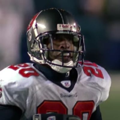 Aqib Talib can be seen in his NFL jersey with helmet on.